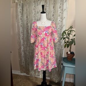 NWOT Pretty in pink, purple, and a peachy crème color floral dress. Size small